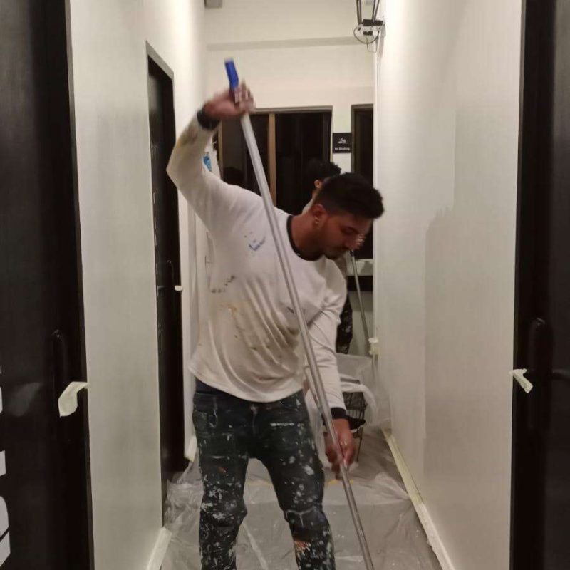 WhatsApp Image 2025-05-13 at 15.24.38 (1) Best Painting Services in Singapore – Professional Painter Applying Fresh White Paint on Interior Wall | HDB and Condo Painting Solutions