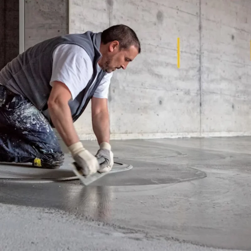a senior painter showing cement screeding